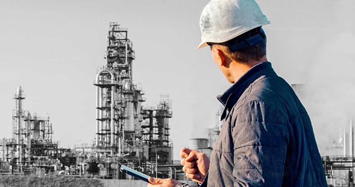 image of a male construction planner-scheduler in front of the screen